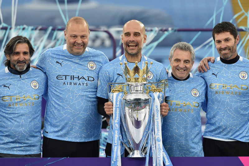 Pep Guardiola lifting trophy