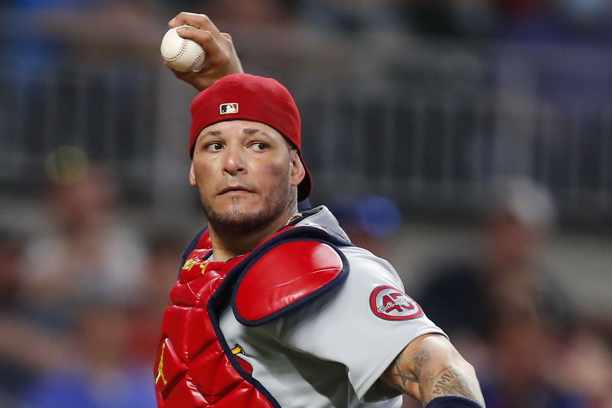 Yadier Molina makes a throw during a game against the Atlanta Braves