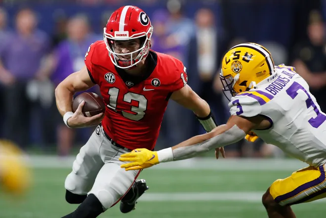 Stetson Bennet moves the rock against LSU during first half of SEC Championship game. Joshua L Jones, Athens Banner-Herald. USA TODAY NETWORK