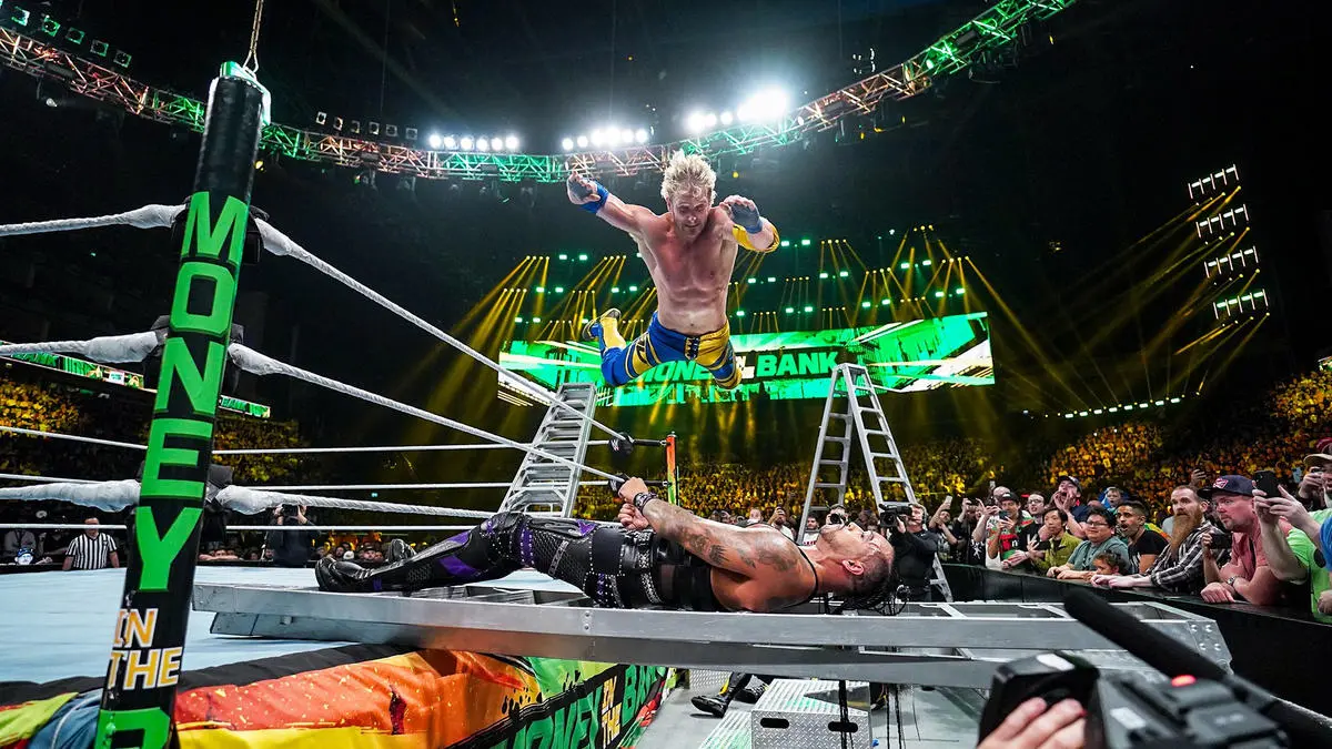 Logan Paul, a likely candidate for a Summerslam celebrity match, lands a splash on eventual Money In The Bank-winner Damian Priest during the Men's Money in the Bank Match.