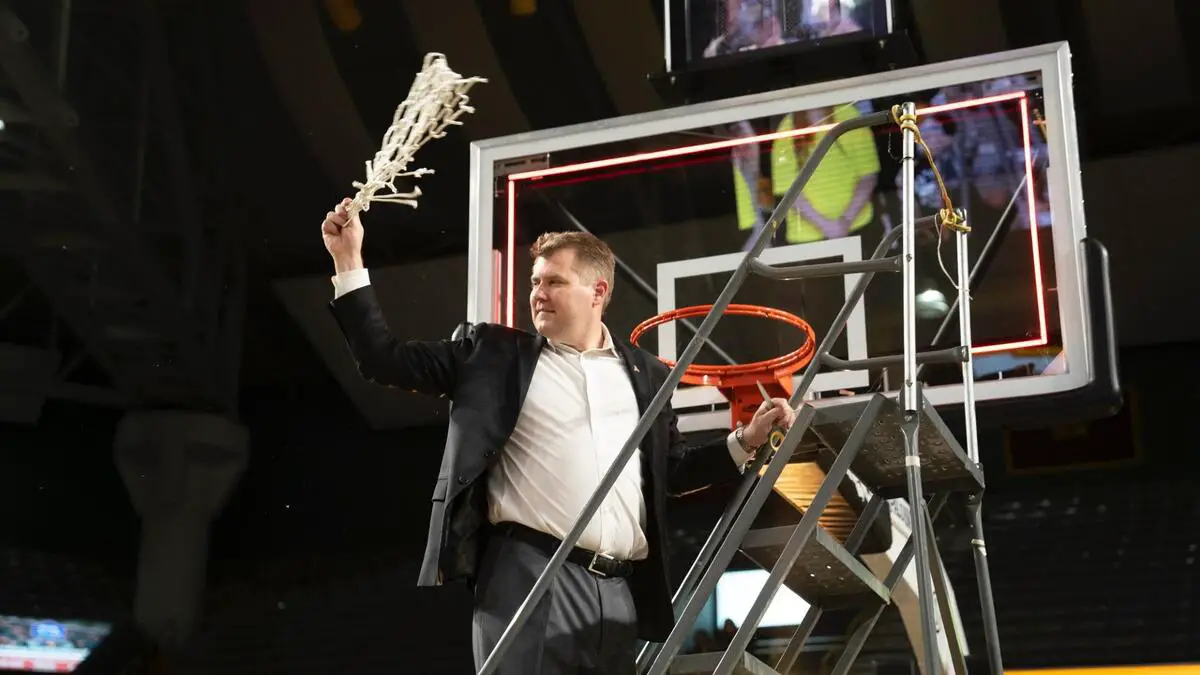 Appalachian State, regular season champions of the mid-major Sun Belt Conference, cuts the net down to celebrate their regular season championship.