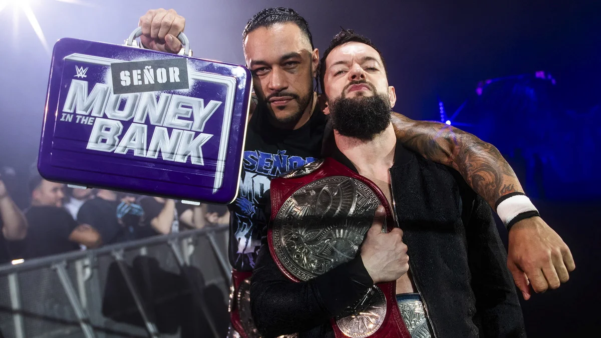 Damian Priest, who was Mr. Money in the Bank through the winter of 2024, poses for a photo with stable mate Finn Bálor