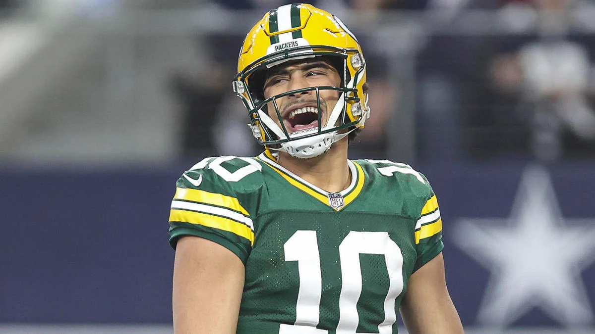 Jordan Love of the Green Bay Packers is all smiles as the NFC North team cruises its way to a win in the 2024 NFL Playoffs.