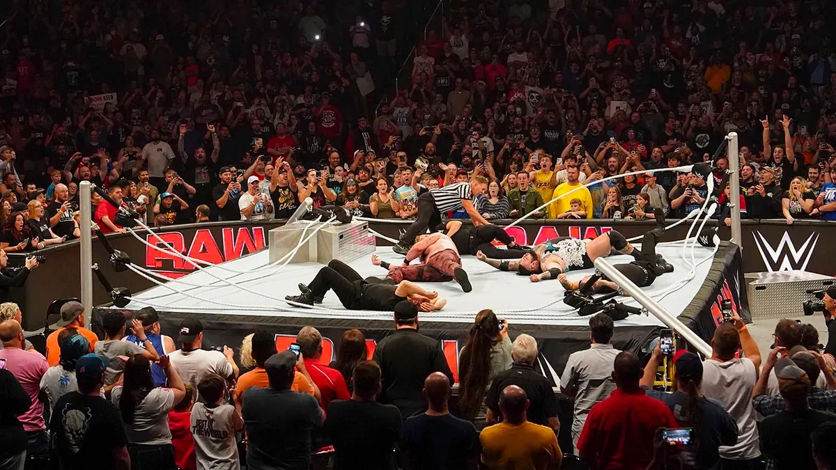 Bronson Reed, Braun Strowman, and a referee all lie motionless on a partially collapsed ring on the September 30, 2024 edition of Monday Night RAW.
