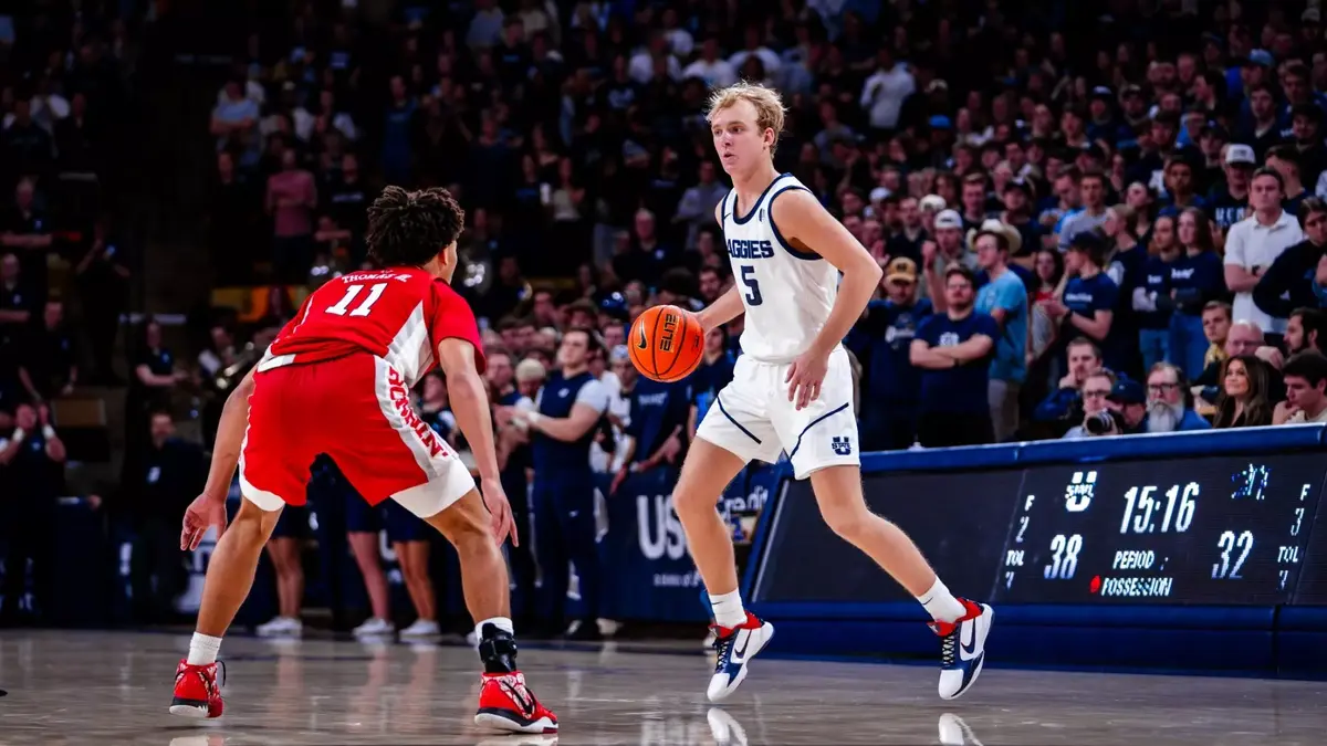 Utah State's Jordy Barnes prepares to make a move against UNLV's Dedan Thomas Jr. during the Aggies' 76-71 win on Wednesday.