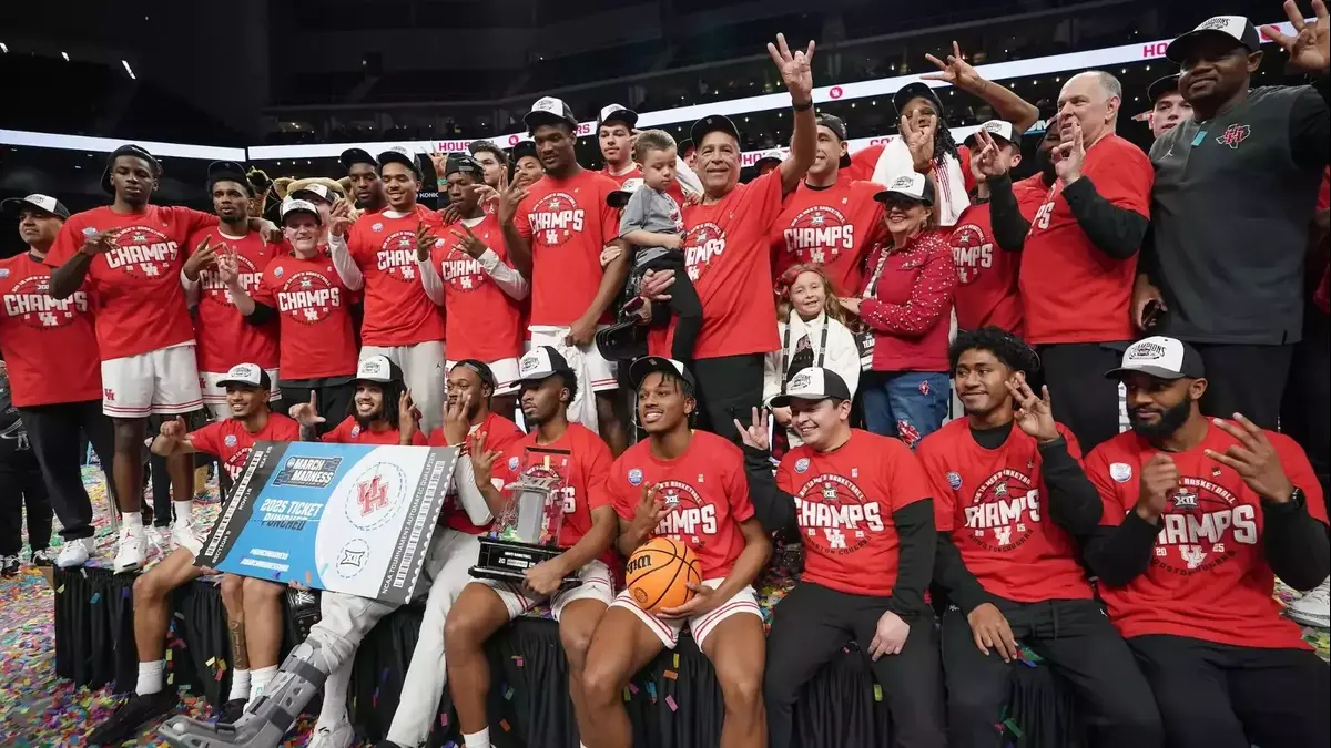 Houston men's basketball poses for a picture after winning the Big 12 conference tournament.